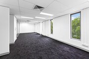 Carpeted Open Plan Office Space with Natural Light