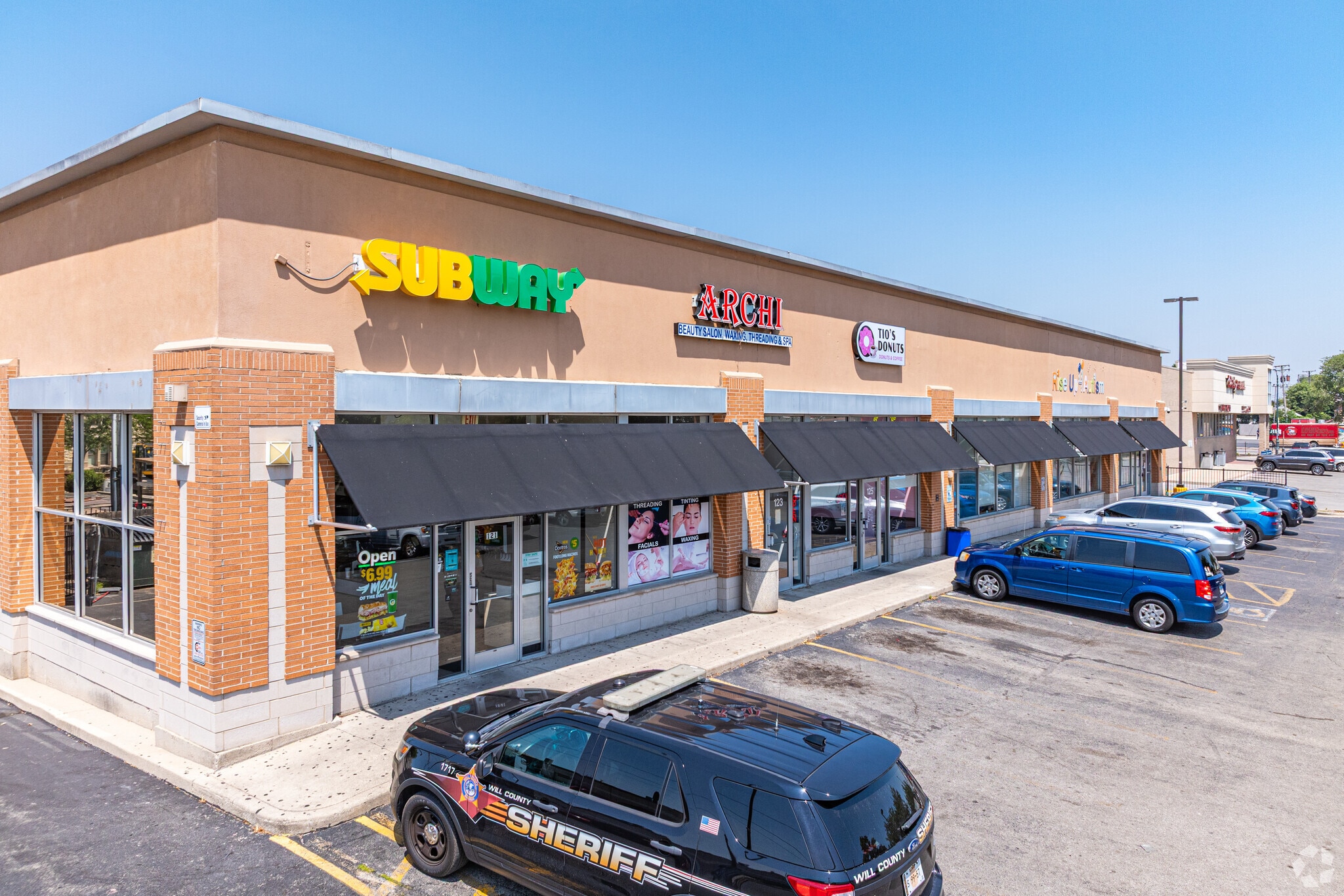 121-131 Collins St, Joliet, IL for lease Building Photo- Image 1 of 6