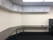 Carpeted office space with lighting