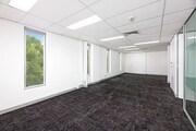 Carpeted Open Plan Office Space with Natural Light